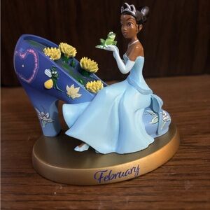 Princess and The Frog Figurine with Gold Base that states “February” NEW in Box